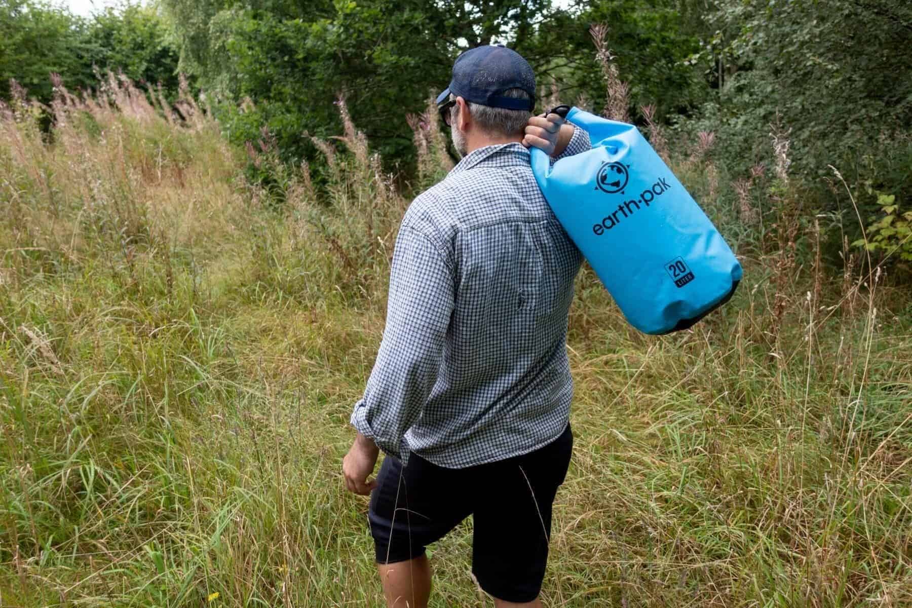 earth-pak-waterproof-held-on-shoulder