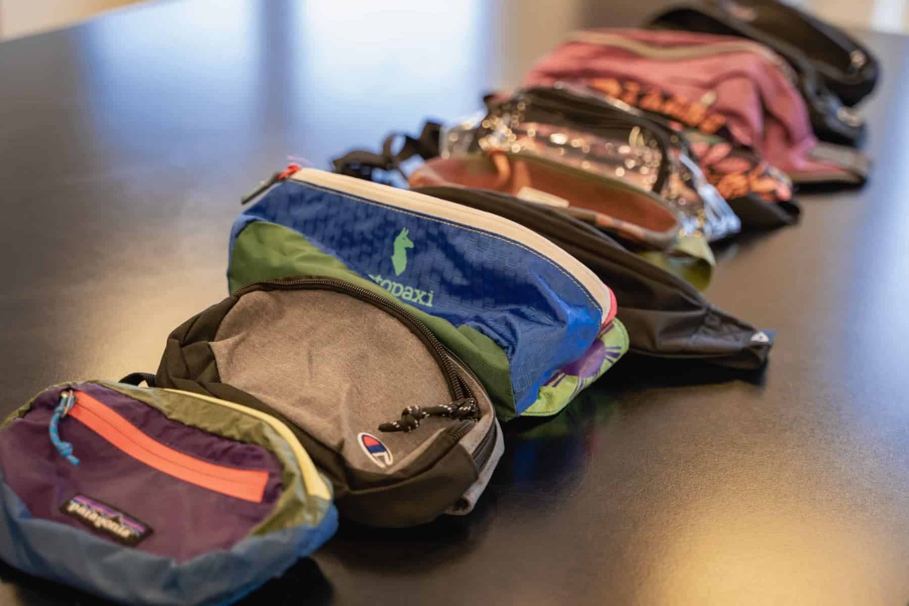 group-of-fanny-packs-lying-on-the-table