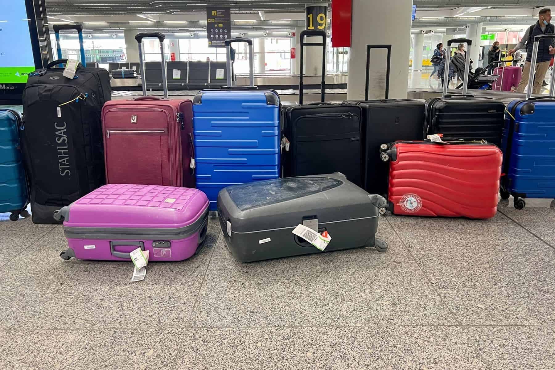 suitcases-and-travel-luggages-picked-up-at-the-baggage-carousel