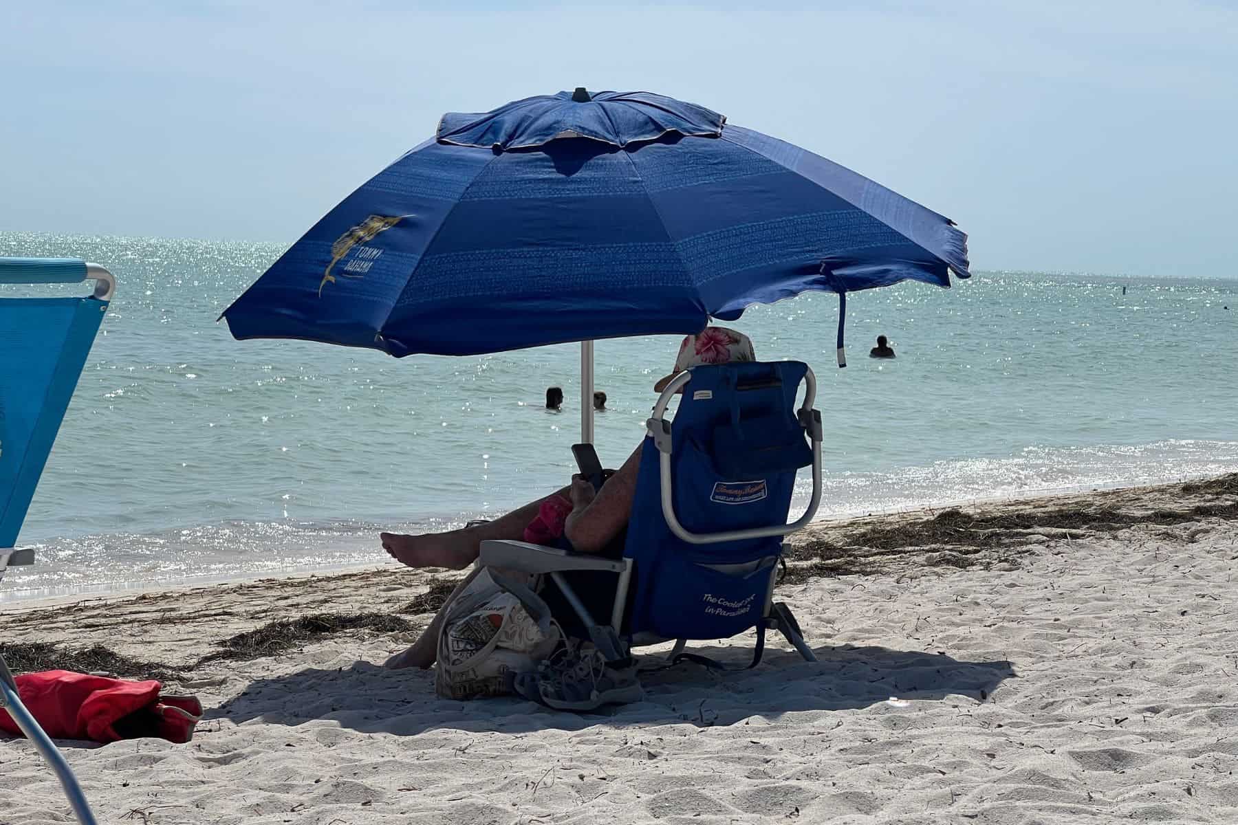tommy-bahama-beach-umbrella-sitting-under